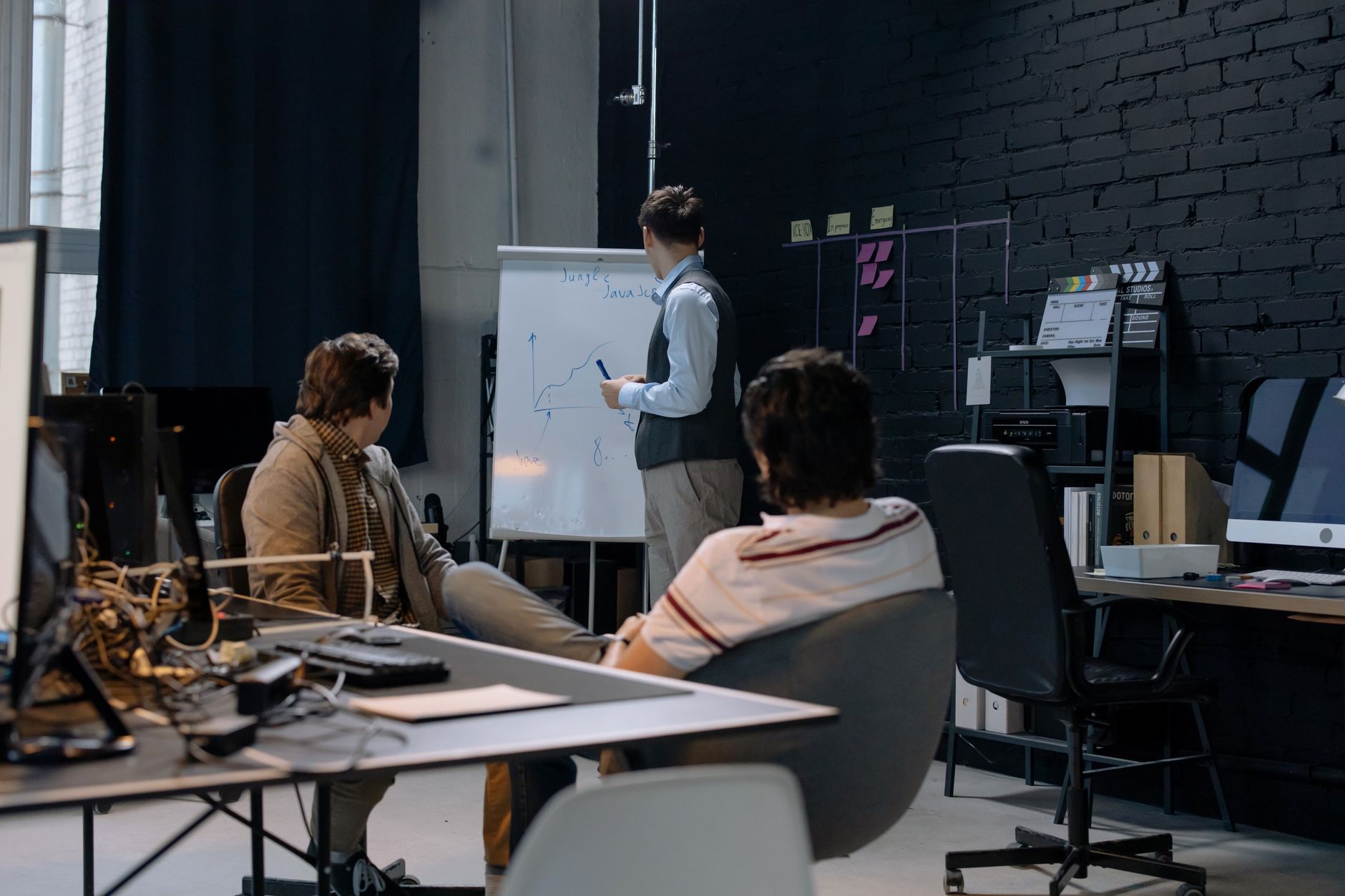Early-stage startup team discussing technology architecture decisions