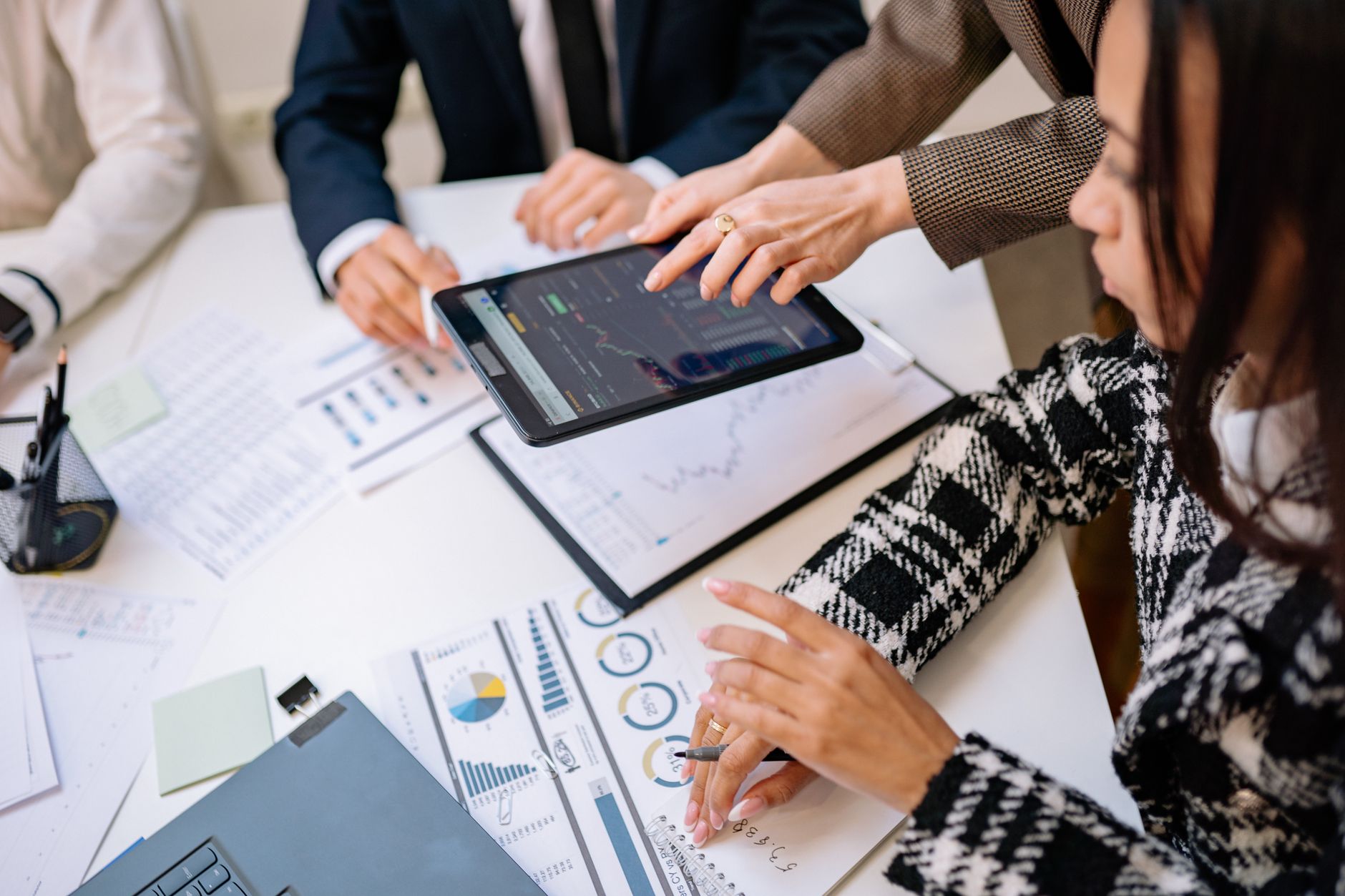 Small business team in a meeting room discussing technology and software strategy