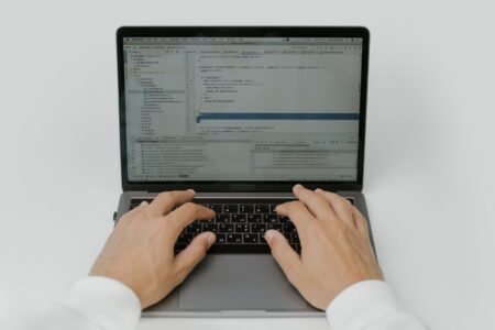 Replit’s Agent Mode Is Crowding Vercel’s v0 Prototyping Base Developer working on a web application in a browser-based code editor