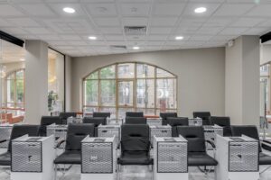Gloss Genius’s Booking Push Is Squeezing Vagaro’s Salon Base Modern hair salon interior with styling chairs and mirrors