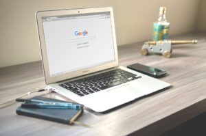 Glean’s Workplace AI Is Quietly Cornering Confluence’s Search Base Team members searching for documents on laptops in a modern office workspace