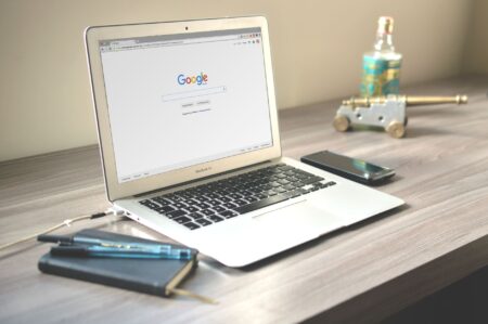 Glean’s Workplace AI Is Quietly Cornering Confluence’s Search Base Team members searching for documents on laptops in a modern office workspace