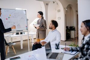 Founders reviewing a pitch deck on a laptop during a startup planning session