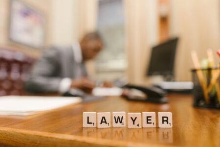 Modern law office with attorneys reviewing documents at a large conference table