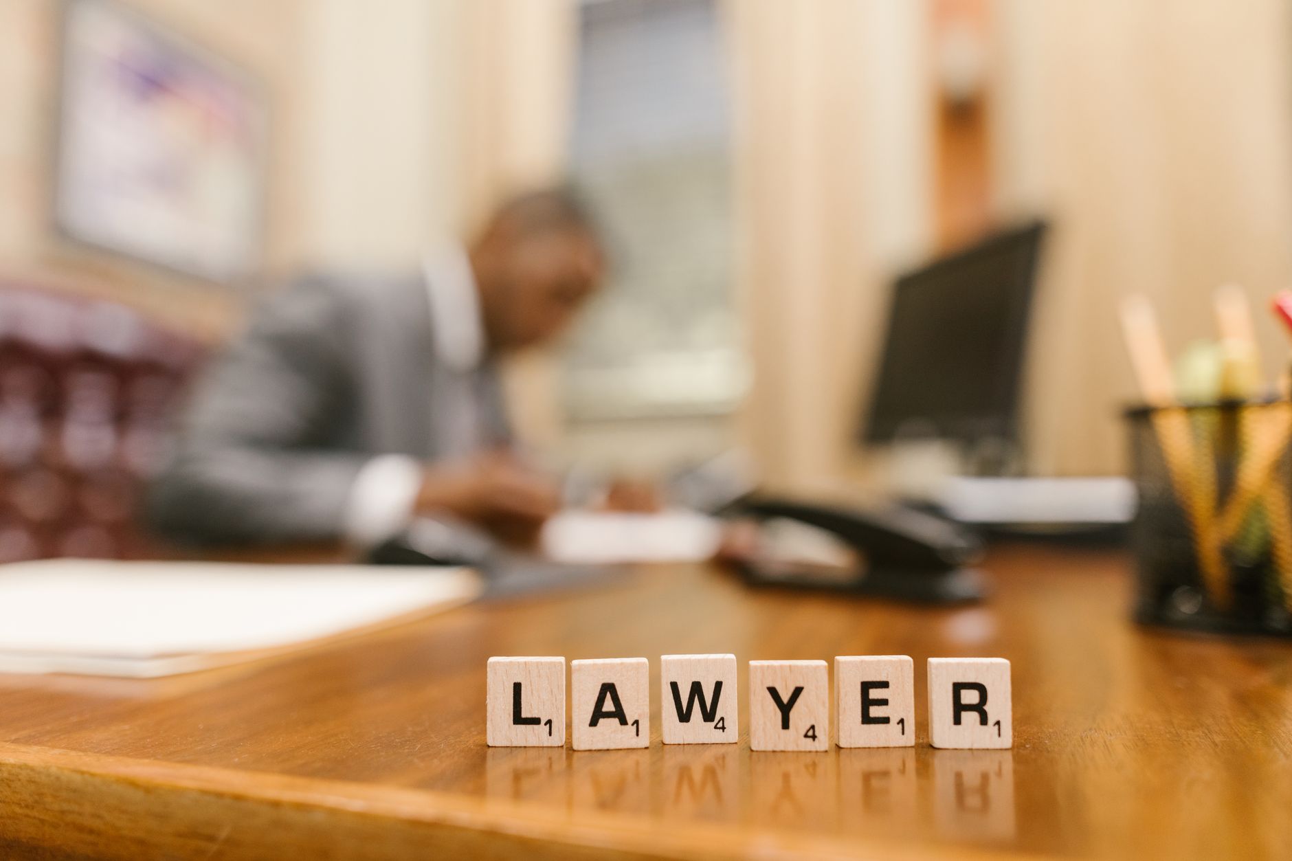 Modern law office with attorneys reviewing documents at a large conference table