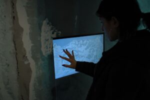 Developer looking at a digital map interface on a computer screen
