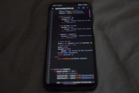 Developer working on a no-code app interface on a laptop screen