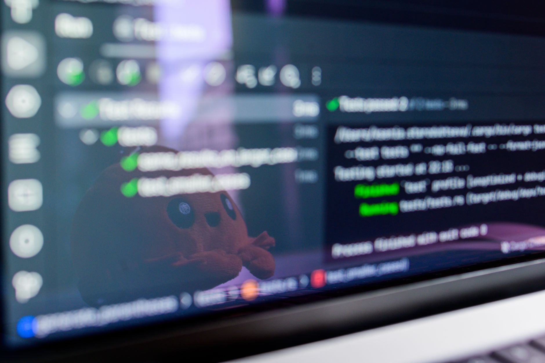 A developer working at a computer with a terminal application open on screen