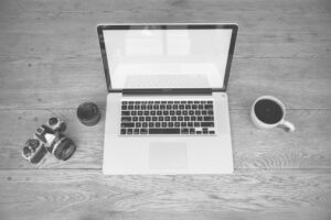 A writer working on a newsletter at a laptop in a home office setting