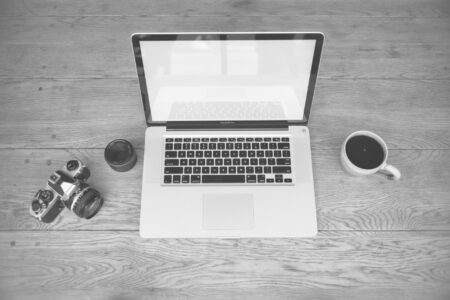 A writer working on a newsletter at a laptop in a home office setting