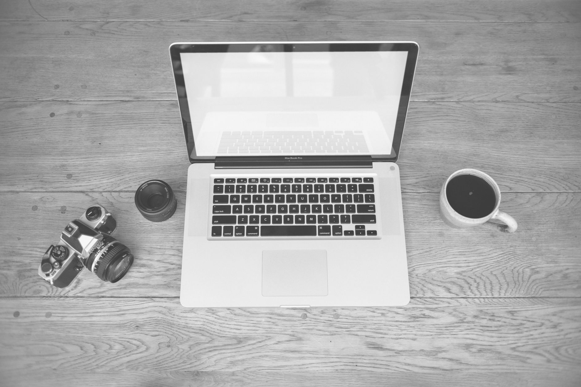 A writer working on a newsletter at a laptop in a home office setting