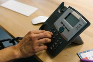 A professional making a phone call in a modern office environment