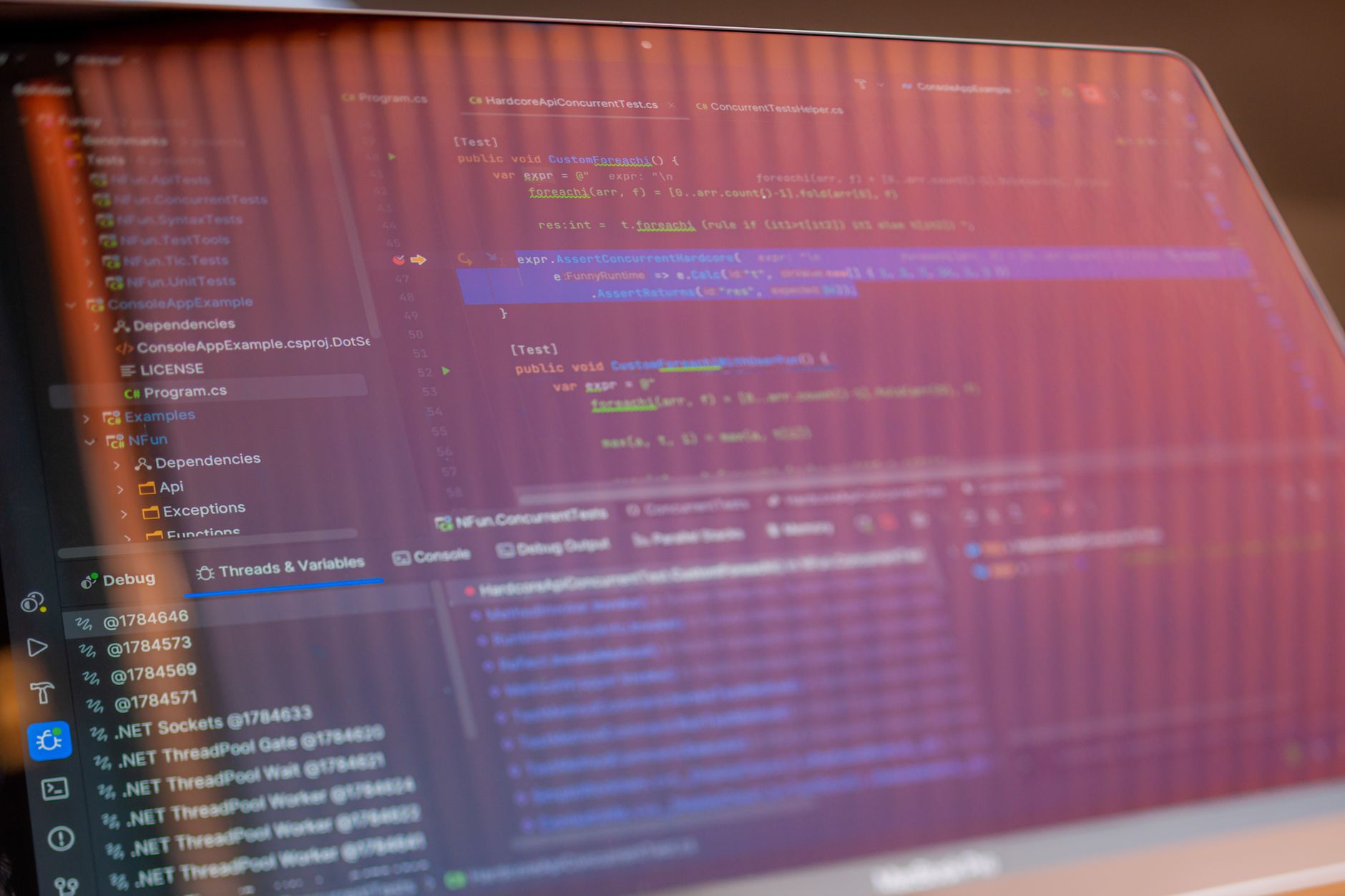 Developer writing code on a monitor in a modern office environment