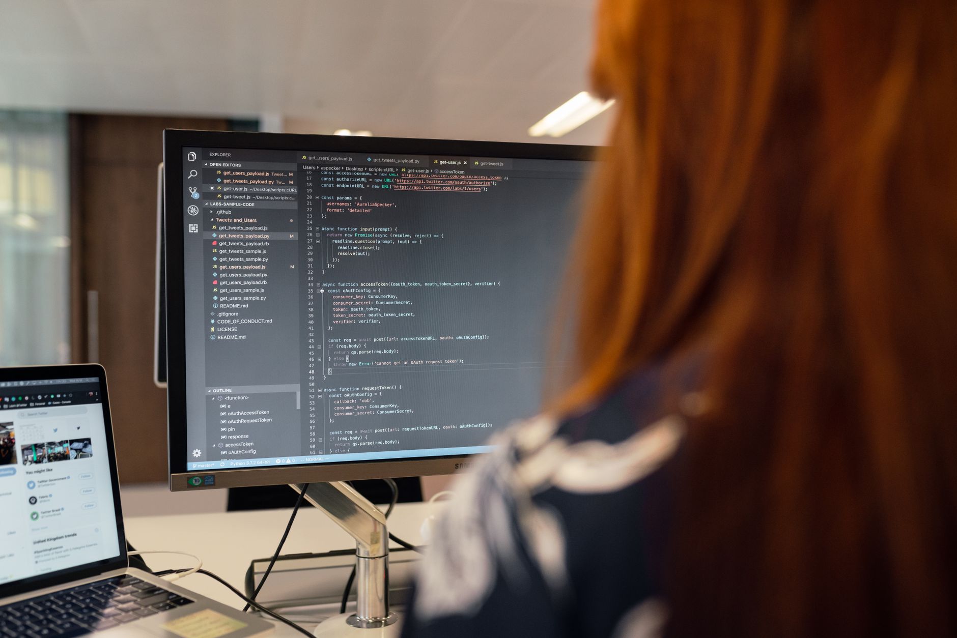 Developer working at a computer terminal on cloud deployment configuration