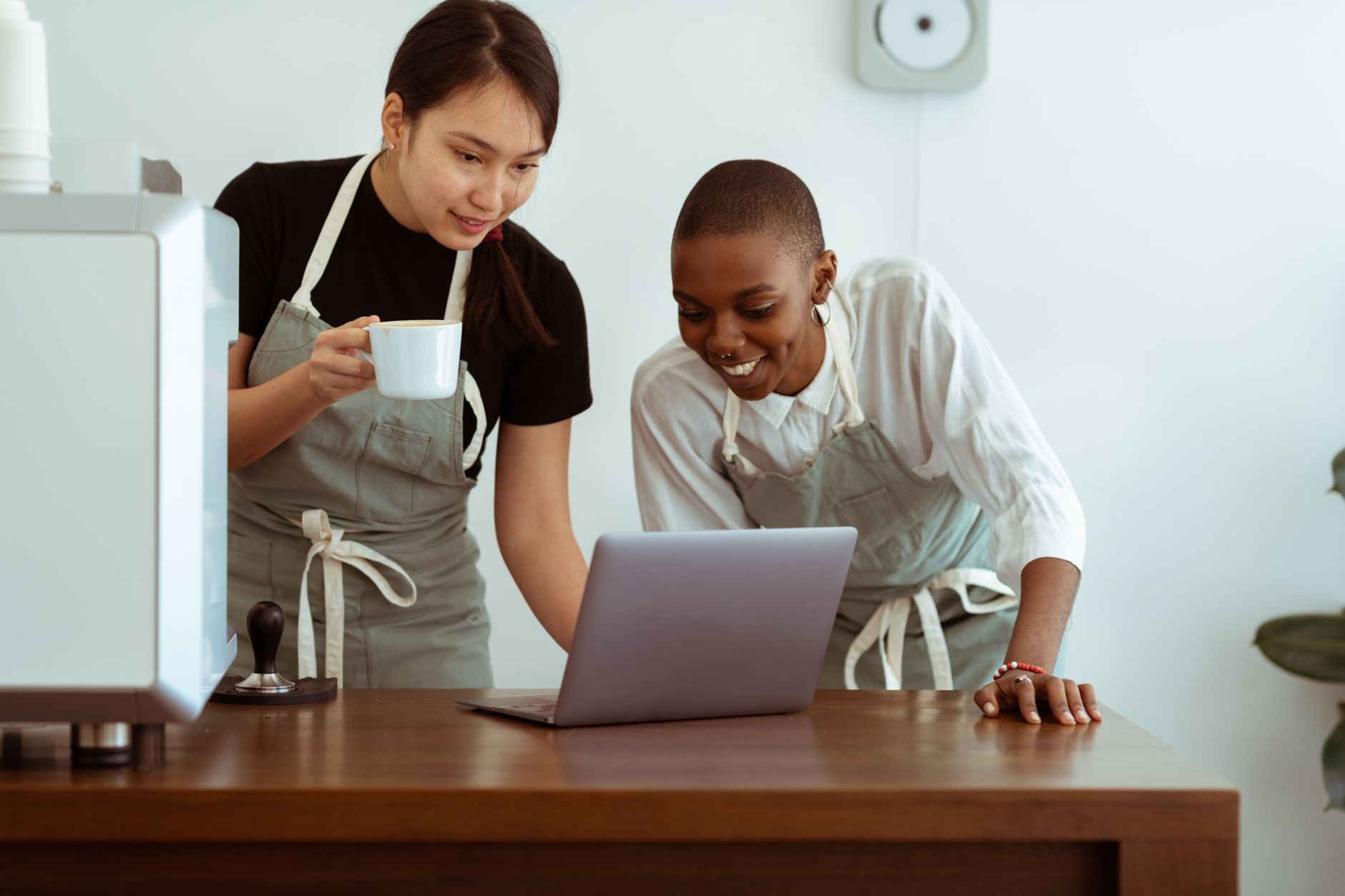 Small business team reviewing a digital tool on a tablet in an office setting