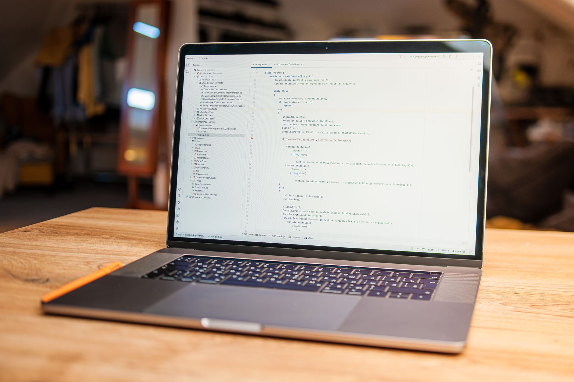 A clean developer workspace with multiple monitors showing code