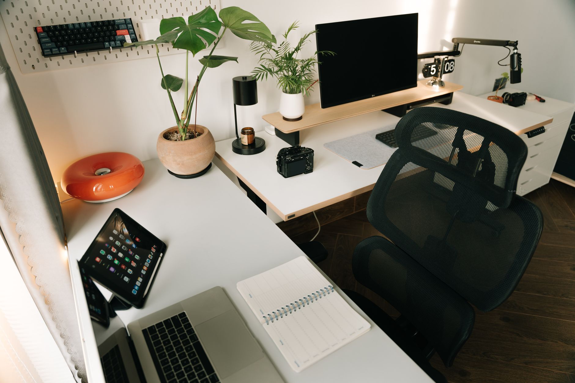 Modern developer workspace with multiple screens showing code and deployment dashboards