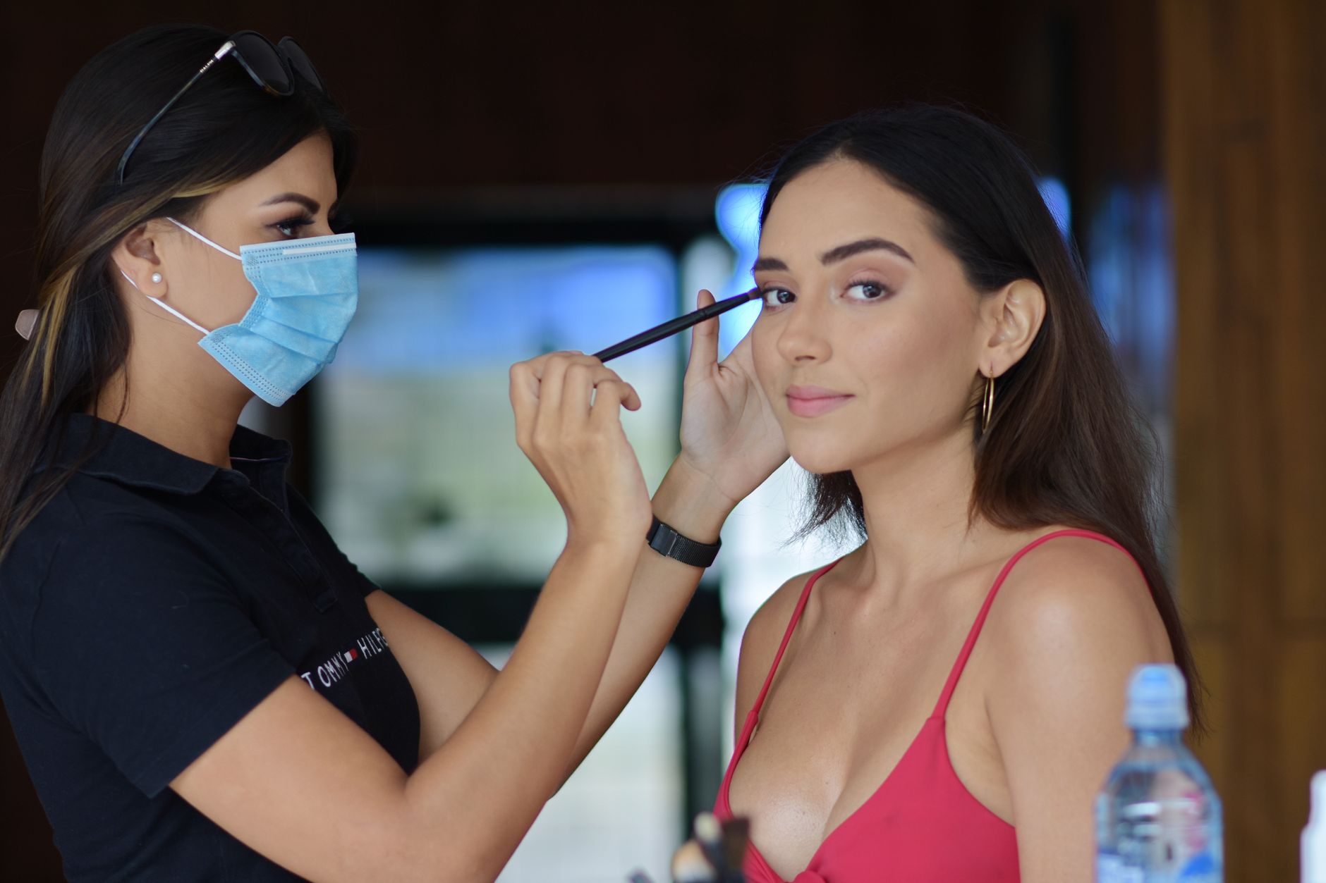 Hair stylist working with a client in a boutique salon setting
