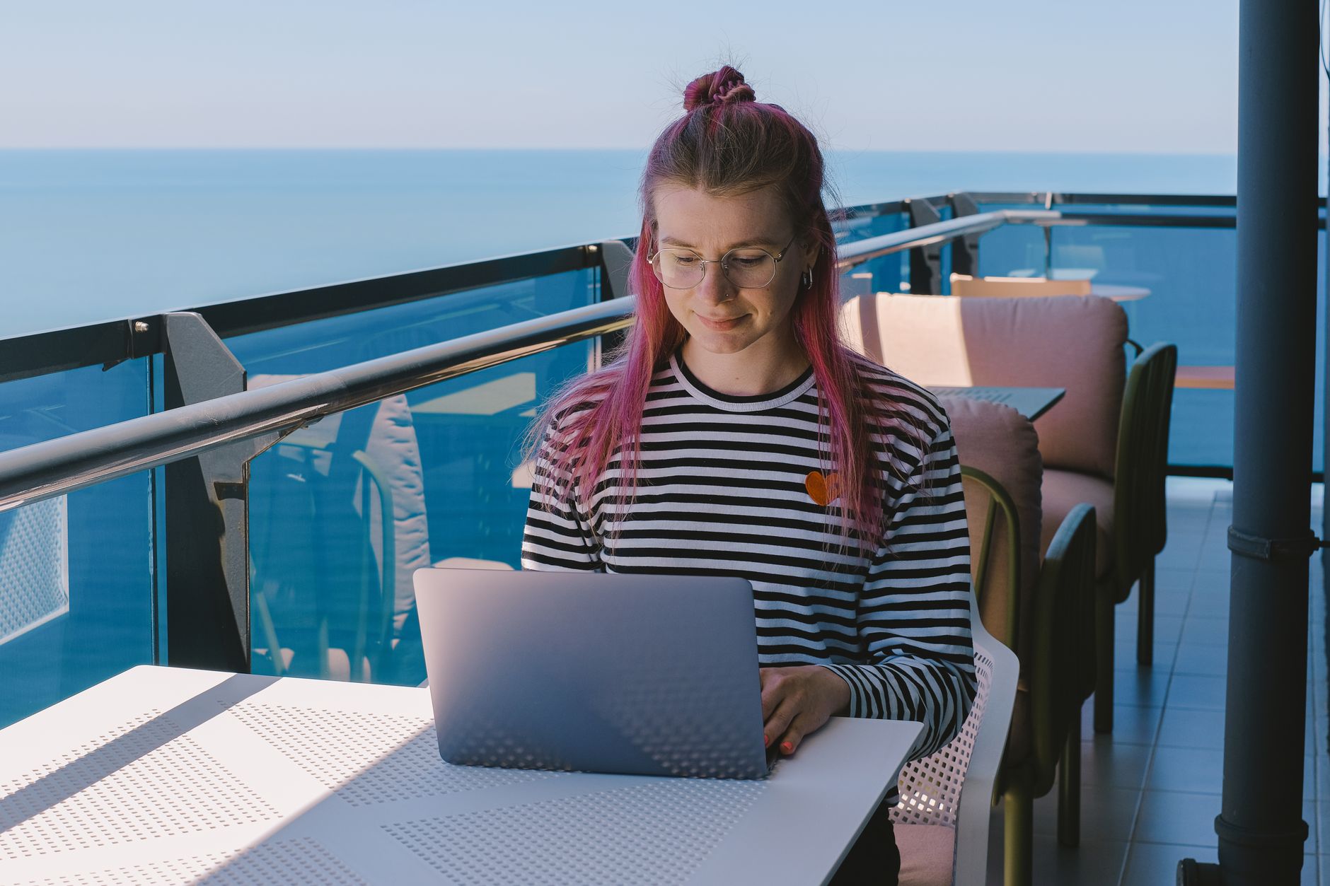 A freelance developer working remotely on a laptop in a home office setting