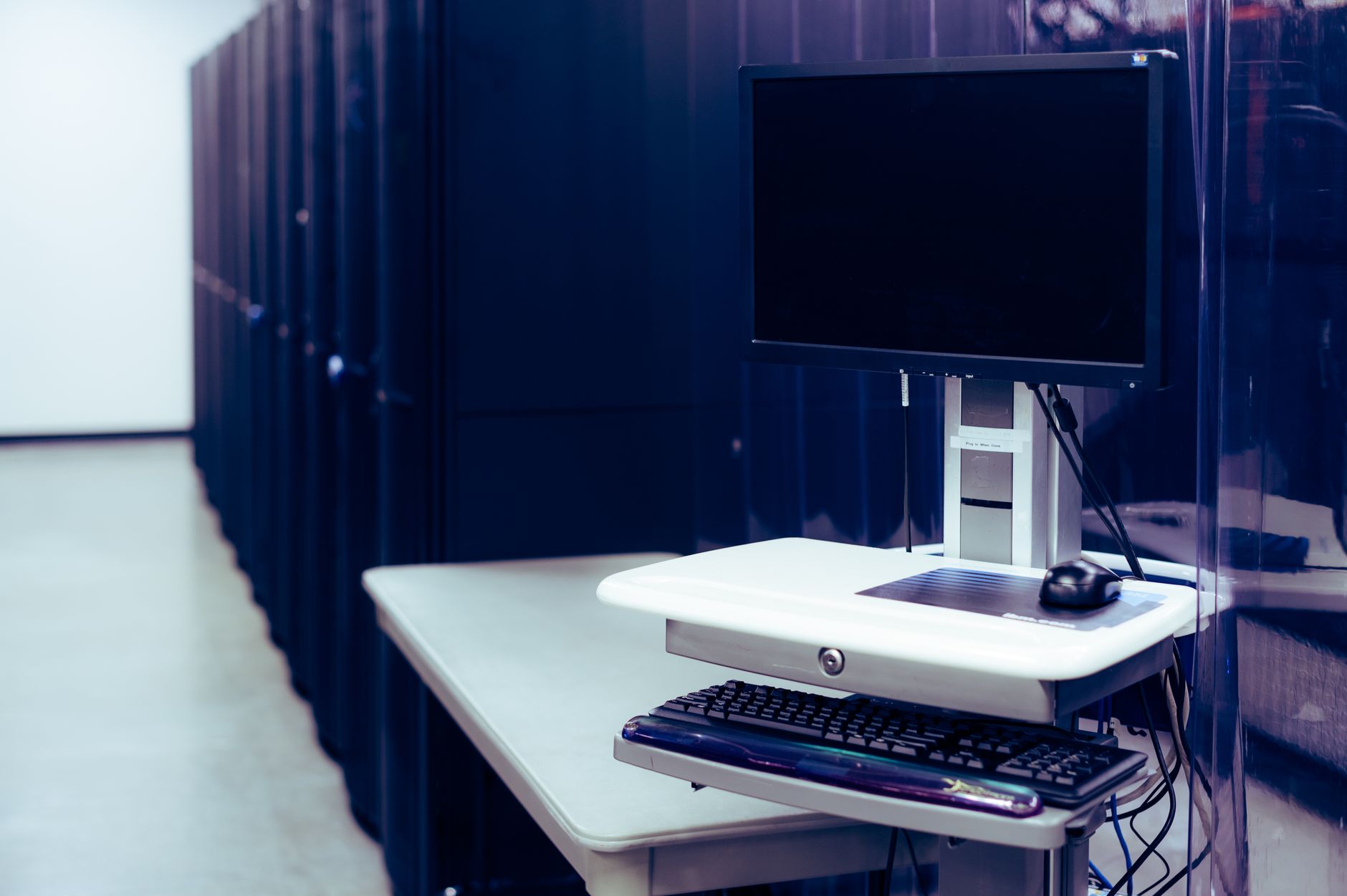 Interior of a modern data center with rows of servers and networking equipment
