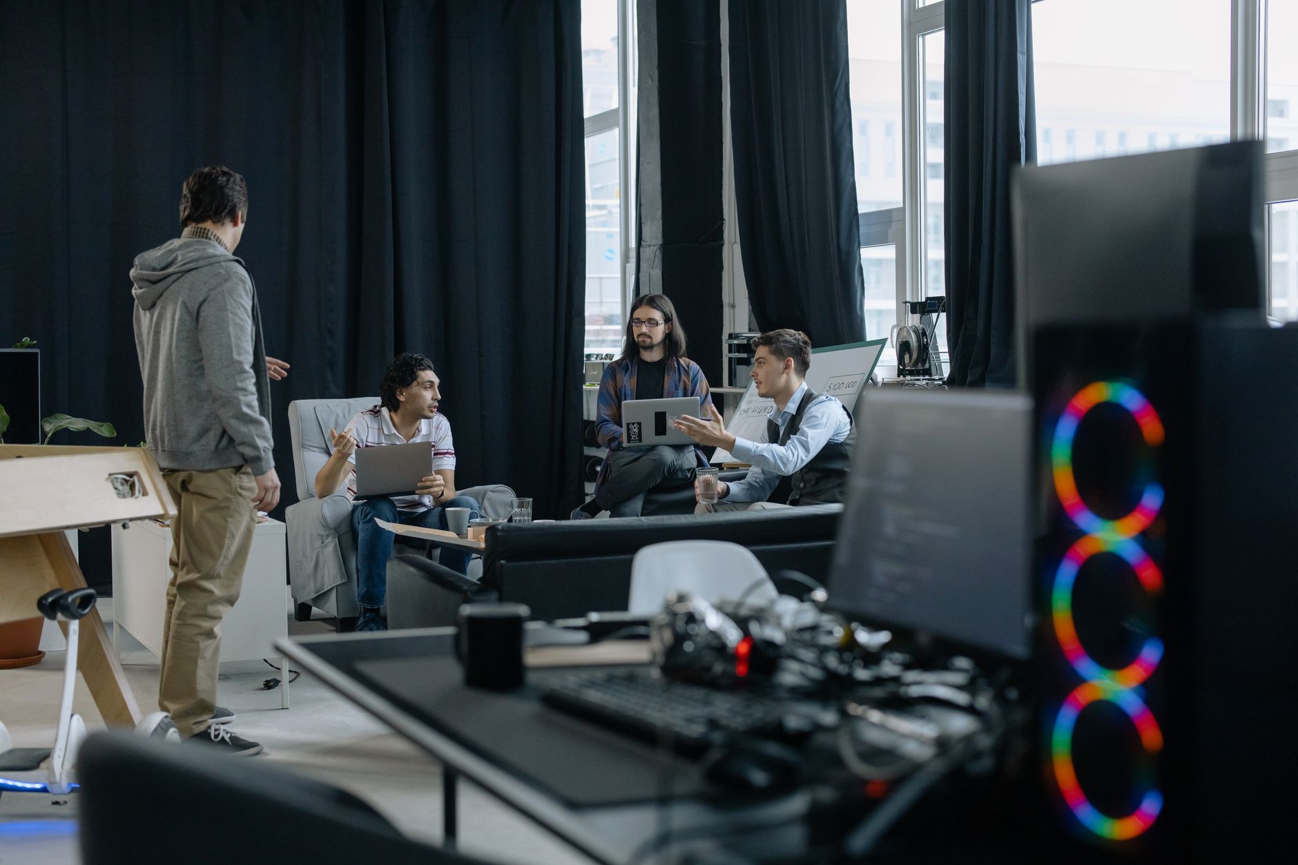 Open-plan startup office with developers working at desks