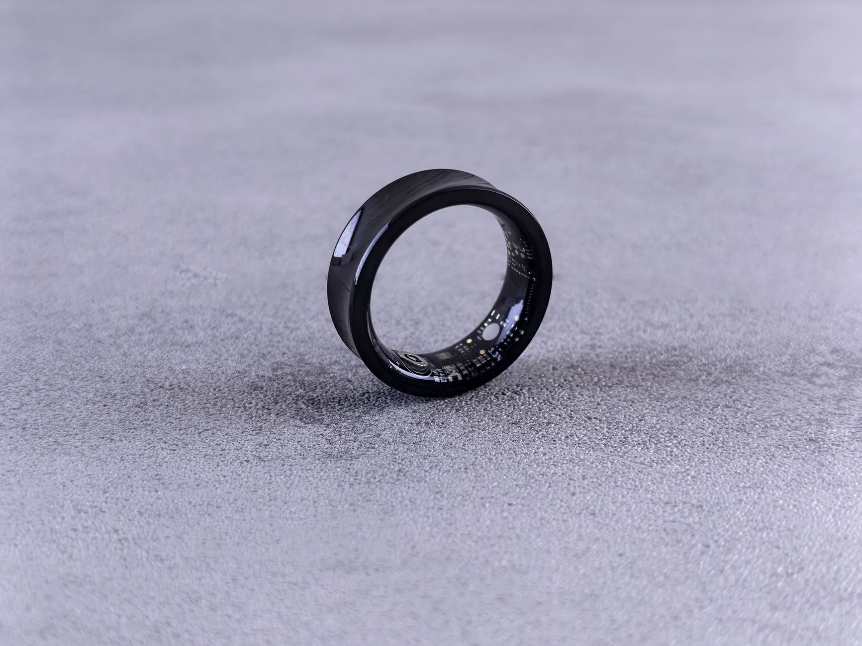 A small wearable device worn around the neck representing ambient recording hardware
