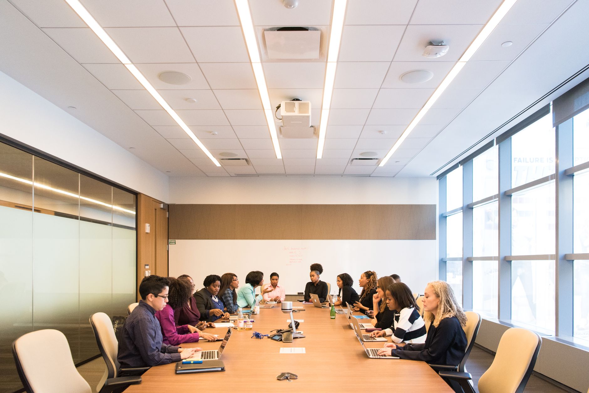 Business professionals reviewing technology benchmarks in a modern office setting