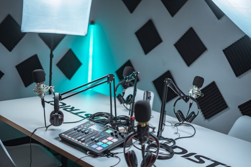 Descript’s Audio Tools Are Quietly Eroding Riverside.fm’s Creator Base A professional podcast recording studio with microphones and audio equipment