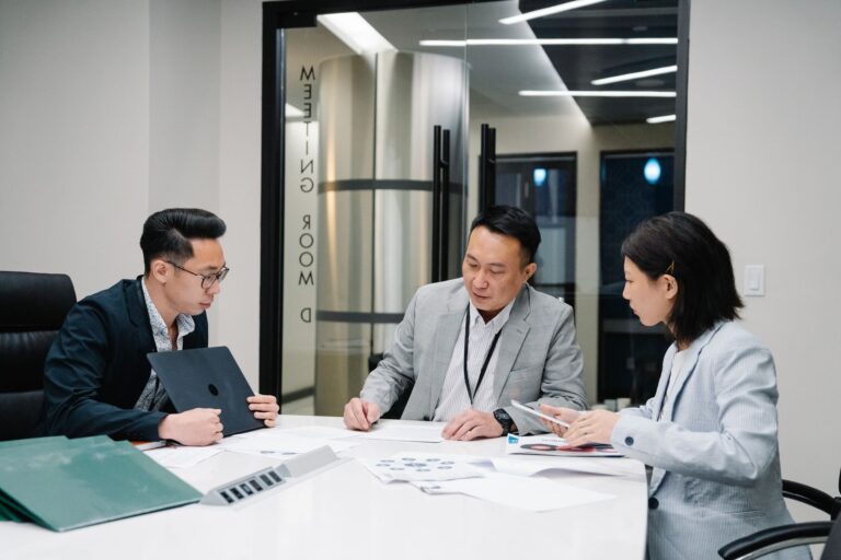 Leapsome’s Performance Platform Is Quietly Cornering Lattice’s HR Base HR team members collaborating around a conference table during a performance review discussion