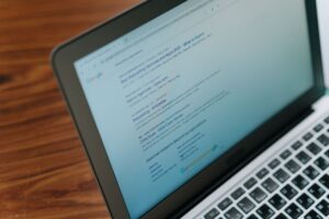 Motor’s AI Browser Is Quietly Pulling Teams Away from Arc’s User Base Person working on a laptop with multiple browser tabs open in a modern workspace