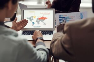 Mapbox’s Pricing Shift Is Quietly Pushing Devs Toward Felt Developer working on a laptop with a digital map interface on screen