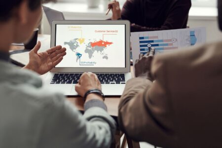 Mapbox’s Pricing Shift Is Quietly Pushing Devs Toward Felt Developer working on a laptop with a digital map interface on screen