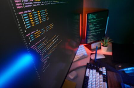 Dopt’s Onboarding SDK Is Quietly Undercutting Appcues’ Growth Base Developer working at a computer with multiple screens showing code and UI components