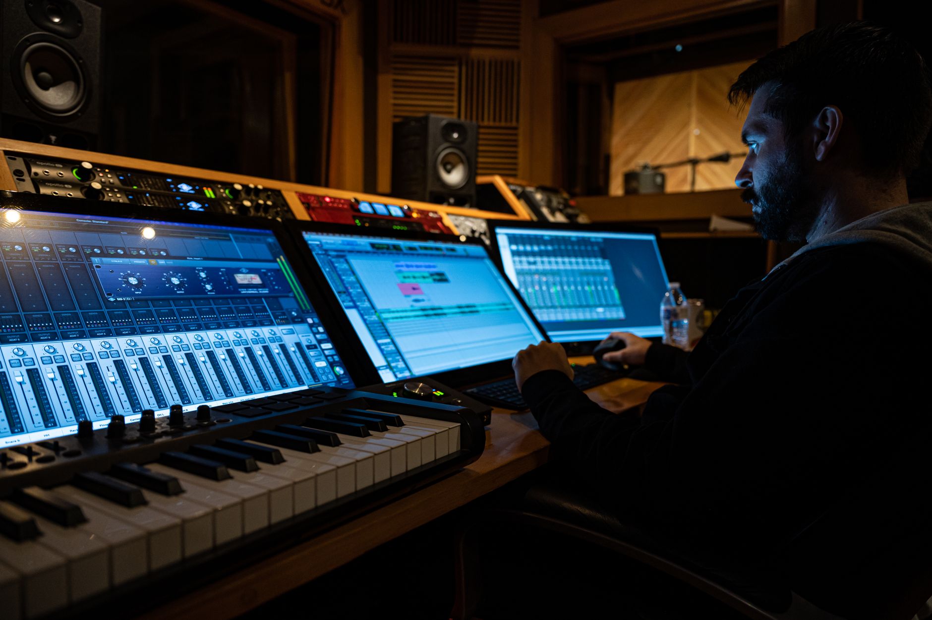 Person recording a screen tutorial at a modern desk setup