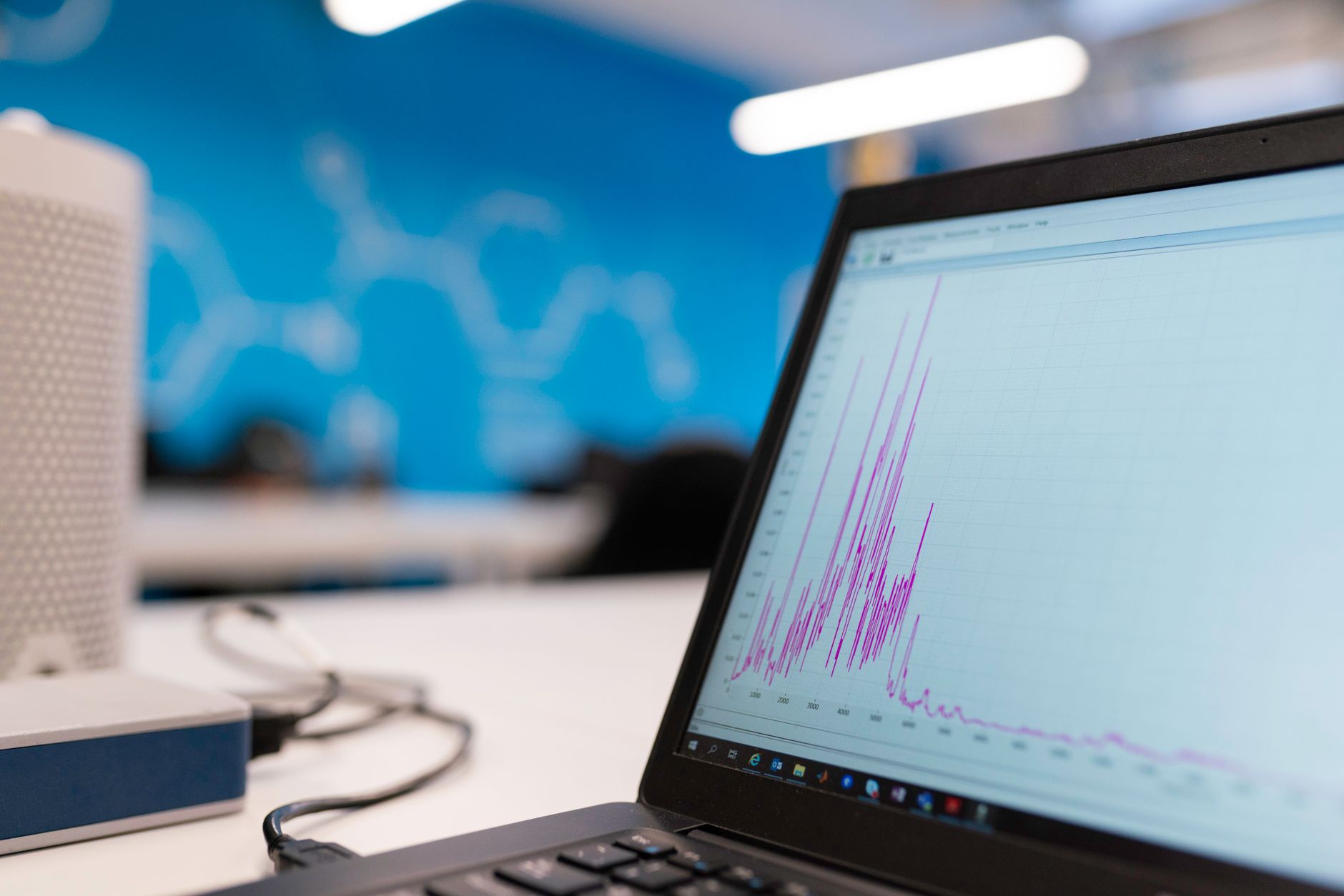 A data analyst reviewing collaborative notebook software on a monitor