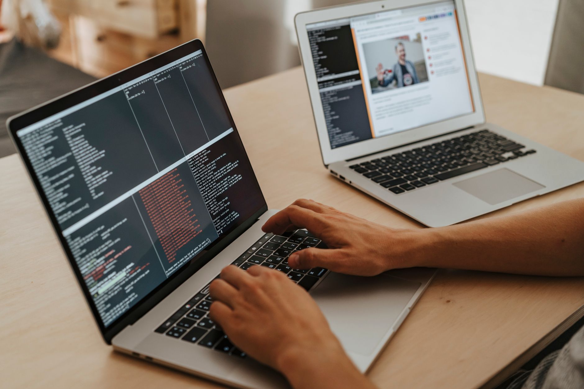 A developer working on code at a laptop, representing AI-assisted software development tools