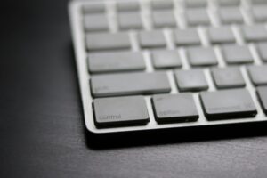 Raycast’s Productivity Layer Is Quietly Cornering Notion’s Power User Base A clean Mac desk setup with keyboard, representing keyboard-driven productivity tools
