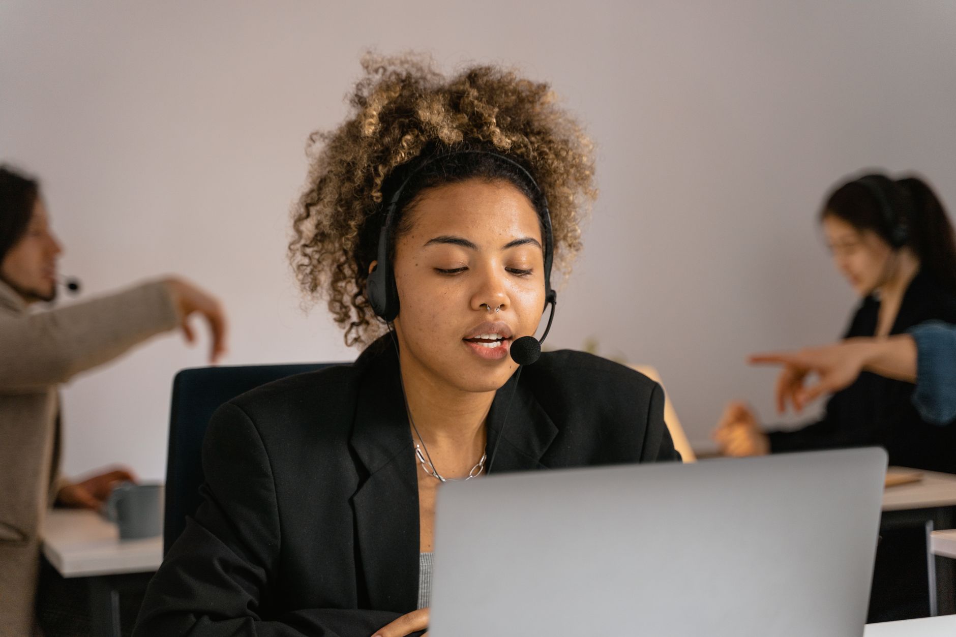 A customer support workspace with a computer showing an inbox interface