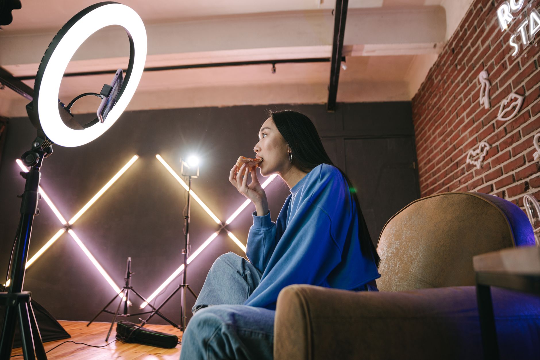 Creator filming content in a minimal home studio environment