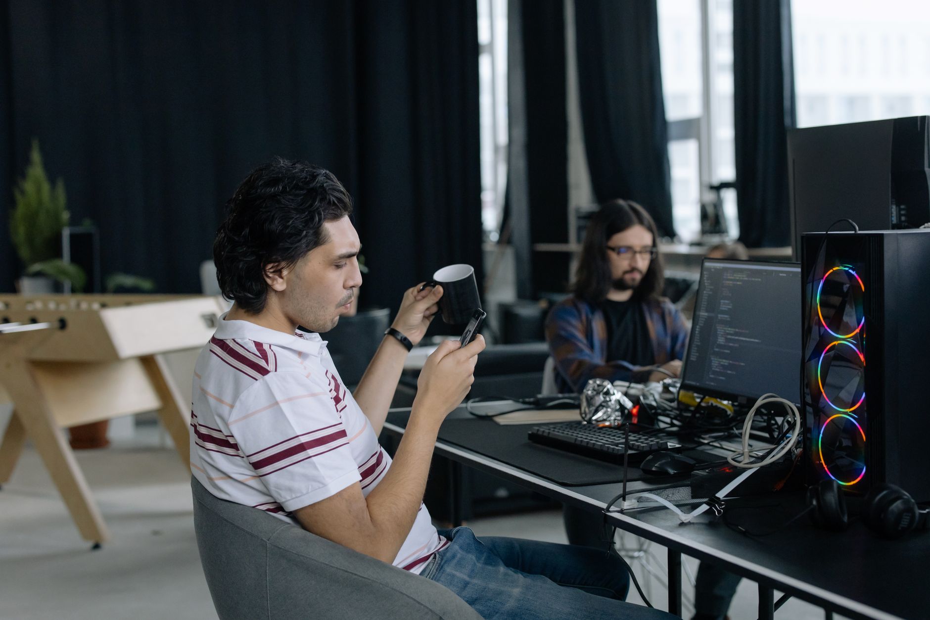 A startup office environment with employees working at computers
