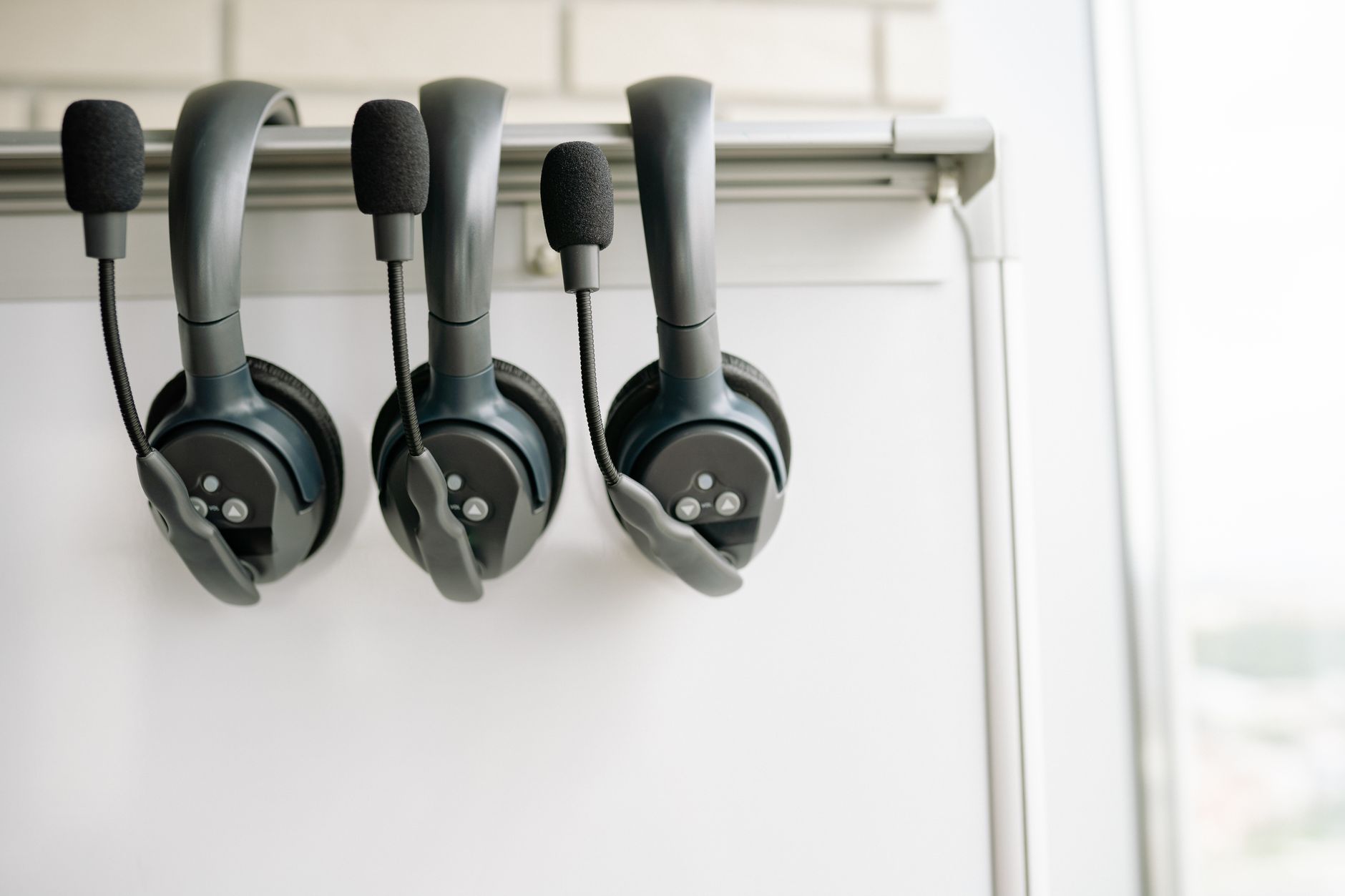 Customer service agent wearing a headset in a professional setting