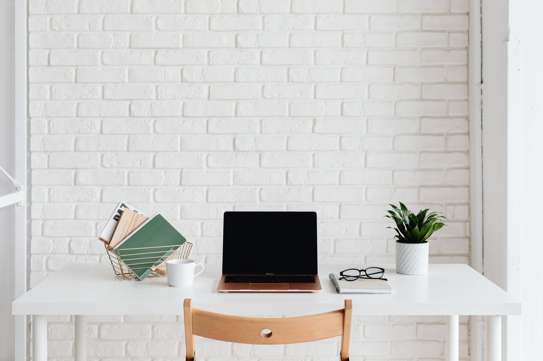 Minimal laptop workspace representing solo operator productivity tools