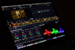 Descript’s Stagnation Is Quietly Handing Captions Its Creator Base A person editing video content on a laptop computer at a desk