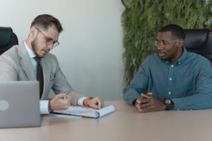 Mercor’s AI Hiring Layer Is Quietly Undercutting Deel’s Talent Base Two professionals conducting a job interview in a modern office setting