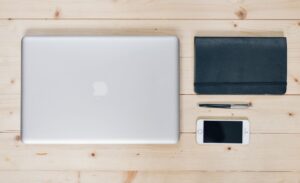 Notion’s Stagnation Is Quietly Handing Coda Its Enterprise Base A modern office workspace with multiple monitors showing productivity software tools