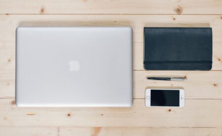 Notion’s Stagnation Is Quietly Handing Coda Its Enterprise Base A modern office workspace with multiple monitors showing productivity software tools