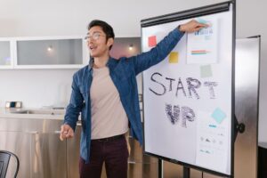 Brex’s Spend Management Layer Is Quietly Cornering Ramp’s Startup Base Team members reviewing financial dashboards on laptops in a modern startup office