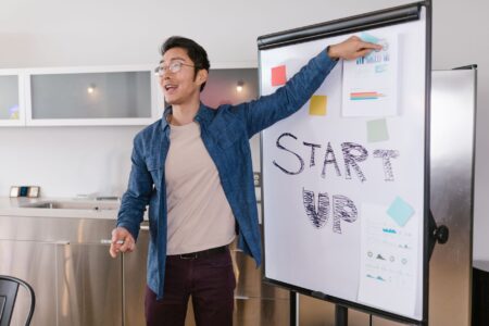 Brex’s Spend Management Layer Is Quietly Cornering Ramp’s Startup Base Team members reviewing financial dashboards on laptops in a modern startup office