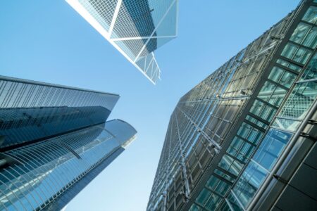 Deel’s Global Payroll Push Is Quietly Cornering Rippling’s Enterprise Base Business professionals reviewing payroll documents in a modern office setting