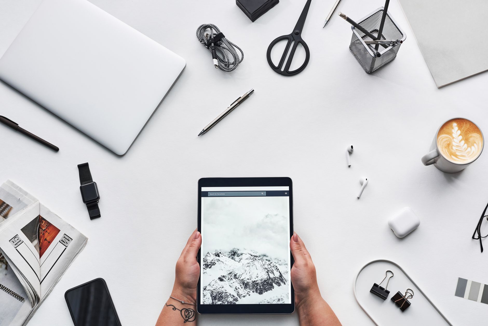 Clean modern workspace with laptop and notebook open for productivity
